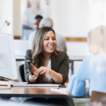 Confident bank manager explains account access to client